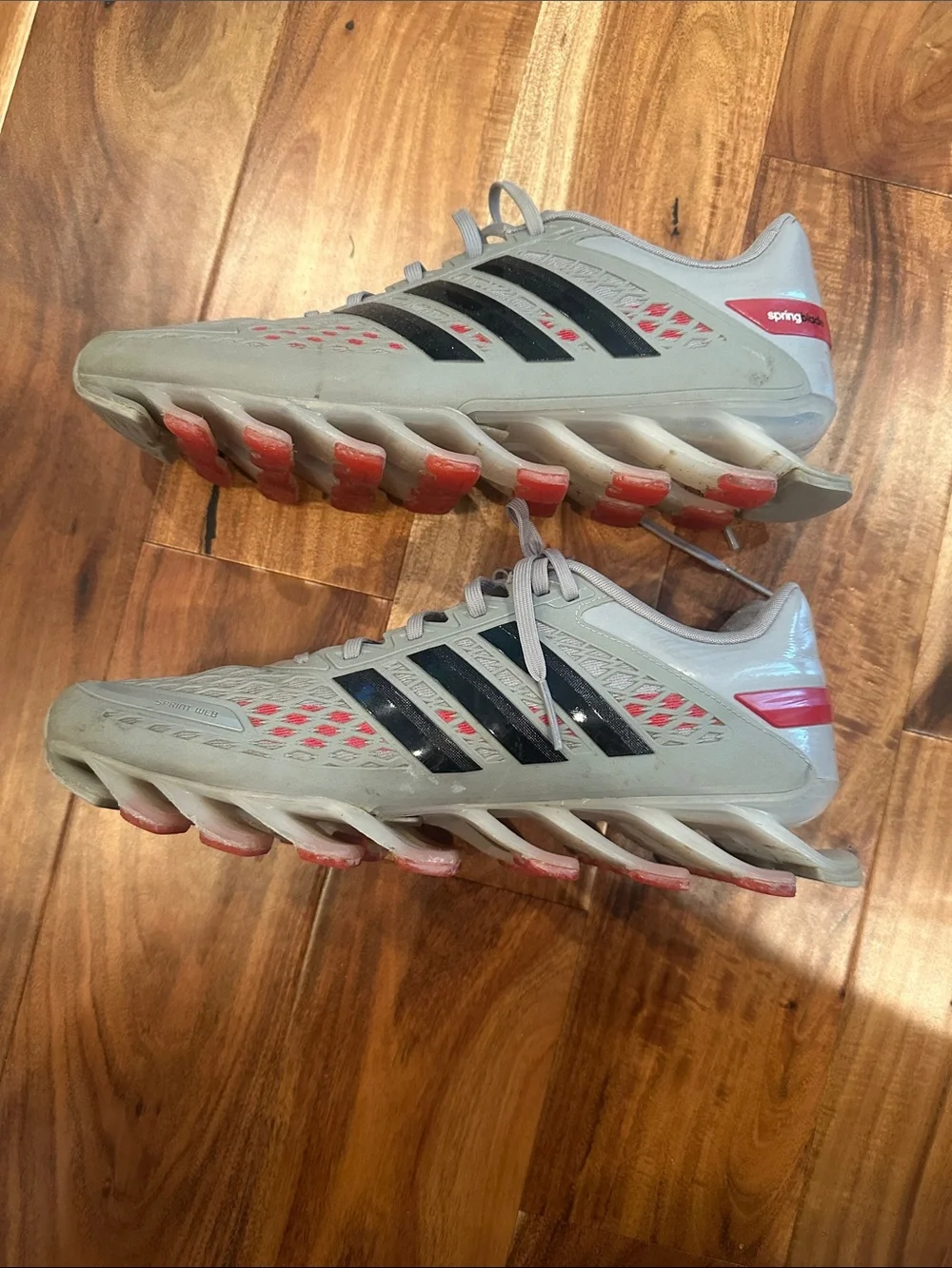 adidas Men's Light Gray Athletic Shoes with Black Stripes and Red Accents